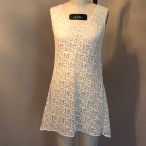 White geo lace tunic with shark bite detail